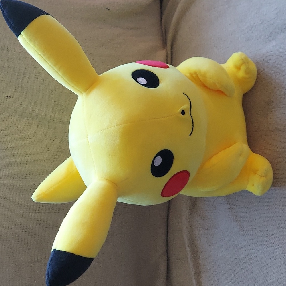 Pokemon pikachu stuff plush smooth to the touch. Gently cared for ,dated 1997.